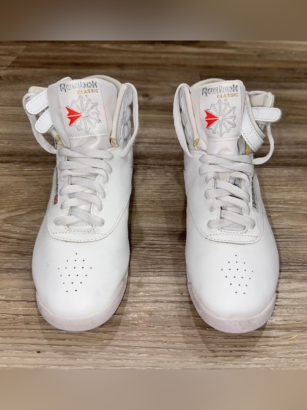 Reebok White High-Top Leather Sneakers with Red Logo